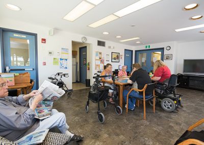 common area with residents doing activities